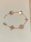 STAR AND SUN 5 MOTIF MOP PINK GOLD BRACELET