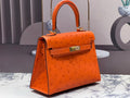 KELLY BAG 20 IN FIRE ORANGE OSTRICH LEATHER WITH GOLD HARDWARE