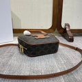 TOP HANDLE BAG 20 IN BLACK TRIOMPHE CANVAS AND BROWN CALFSKIN