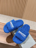FURRY SLIDES IN COBALT BLUE CURLY SHEARLING