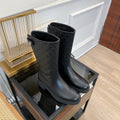 GG EMBOSSED LEATHER ANKLE BOOTS IN BLACK CALFSKIN