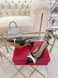 GARAVANI POINTED SLINGBACK PUMPS IN BLACK CALFSKIN