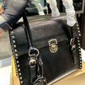 STUDDED TOP HANDLE BAG 33 IN BLACK SMOOTH CALFSKIN
