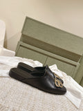 FLAT MULES IN BLACK SMOOTH CALFSKIN GOLD BUCKLE