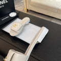 FLAT MULE IN WHITE LAMBSKIN