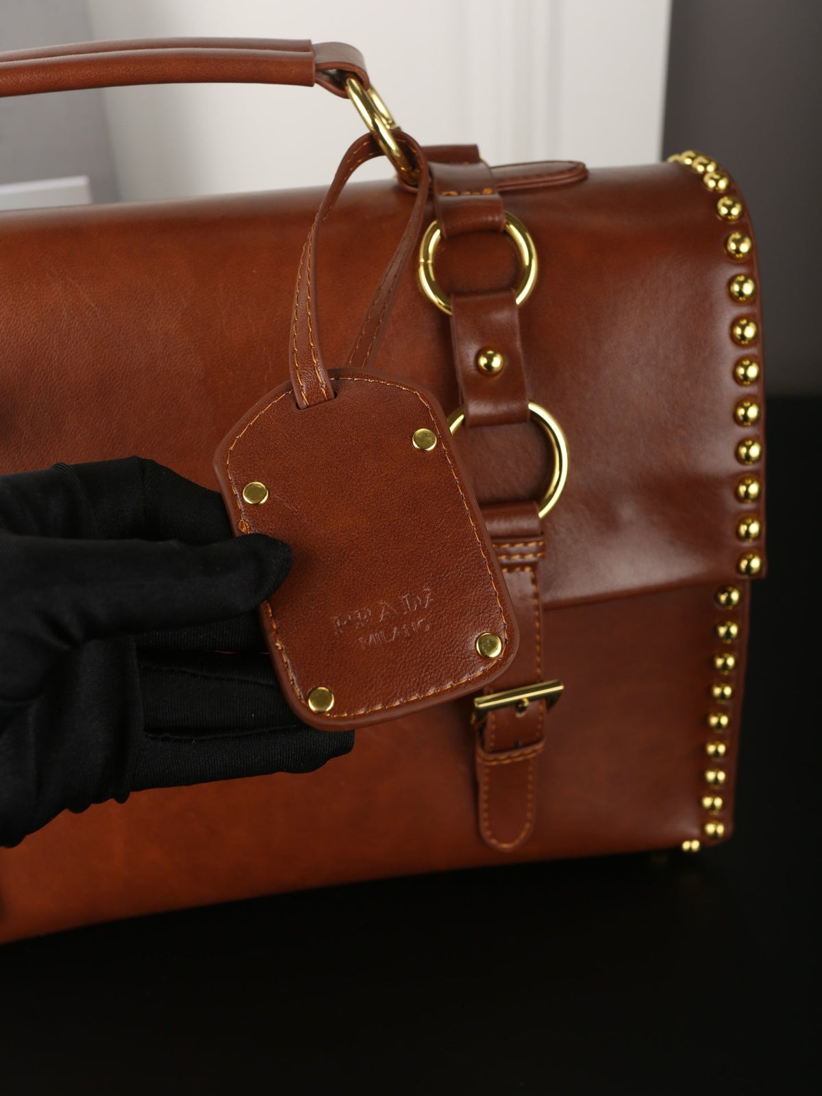 STUDDED BRIEFCASE 34 IN BROWN SHINY SMOOTH CALFSKIN