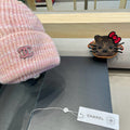 STRIPED KNITTED HAT IN LIGHT PINK WOOL 424515