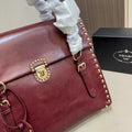 STUDDED TOP HANDLE BAG 33 IN BURGUNDY RED SMOOTH CALFSKIN