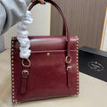 STUDDED TOP HANDLE BAG 33 IN BURGUNDY RED SMOOTH CALFSKIN