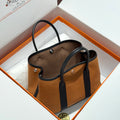 GARDEN PARTY 30CM IN ORANGE MINIMUM TOILETS COTTON CANVAS AND BLACK CALFSKIN