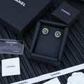 STUD EARRINGS IN GREY ACRYLIC AND BLACK CENTER WITH GOLD METAL DOUBLE C LOGO