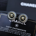 STUD EARRINGS IN GREY ACRYLIC AND BLACK CENTER WITH GOLD METAL DOUBLE C LOGO