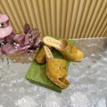HORSEBIT SLIDE SANDAL IN GOLD MONOGRAM CANVAS AND SHEEPSKIN LINING