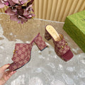HORSEBIT SLIDE SANDAL IN WINE RED MONOGRAM CANVAS AND SHEEPSKIN LINING
