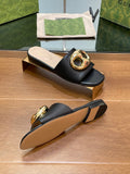 FLAT MULE IN BLACK CALFSKIN WITH GOLD HARDWARE