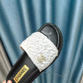KNIT SLIPPERS IN LIGHT PINK WOVEN SATIN AND BLACK SHEEPSKIN