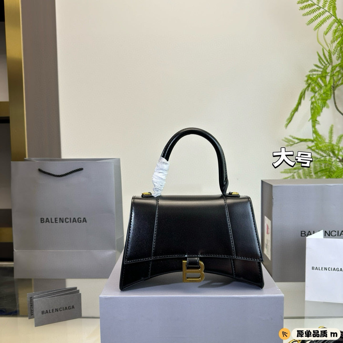 HOURGLASS HANDBAG 22 IN BLACK SHINY BOX CALFSKIN GOLD HARDWARE