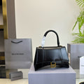 HOURGLASS HANDBAG 22 IN BLACK SHINY BOX CALFSKIN GOLD HARDWARE