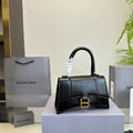 HOURGLASS HANDBAG 19 IN BLACK SHINY BOX CALFSKIN GOLD HARDWARE