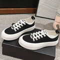 LACE-UP SNEAKERS IN BLACK CANVAS