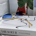 FIRST CRYSTAL RIMLESS OVAL FRAME SUNGLASSES 557152 IN METAL