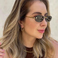 FIRST CRYSTAL RIMLESS OVAL FRAME SUNGLASSES 557152 IN METAL