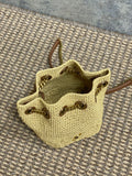 DRAWSTRING BUCKET BAG 19 IN BEIGE WOVEN RAFFIA AND CALFSKIN