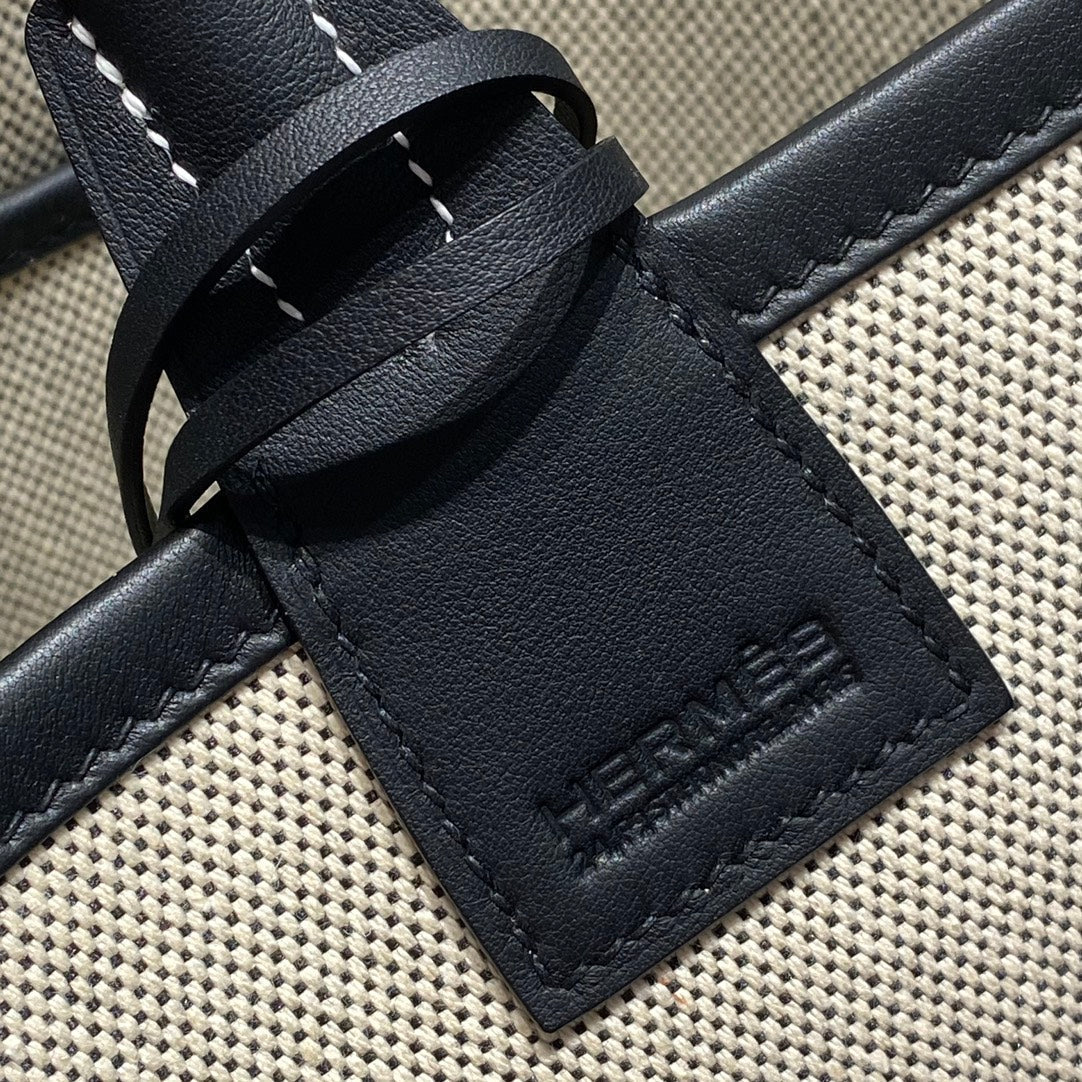 STEEPLE 28 BAG IN OFF-WHITE H CANVAS AND BLACK SWIFT CALFSKIN