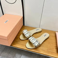 FLAT SLIDE IN LIGHT GOLD CALFSKIN