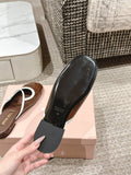 FLAT MULE IN CHOCOLATE BROWN PATENT CALFSKIN