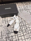 FLAT SLINGBACKS IN WHITE CALFSKIN AND BLACK FABRIC
